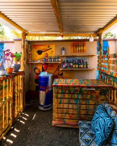a garage with a table and a shelf in it at Mango Hostel Arusha in Arusha