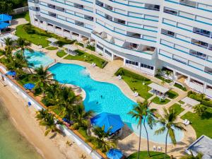 an aerial view of a resort with a swimming pool at Las Olas, Juan Dolio 2bed2bath Condo in Guayacanes