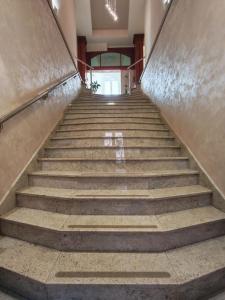 a stairway in a building with a stair case at KONDOR apartmani in Vrnjačka Banja