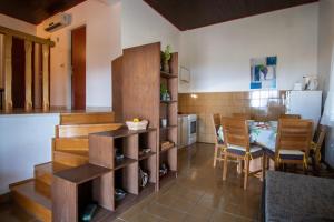 a kitchen and dining room with a table and chairs at House Marija in Primošten