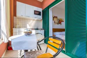 a kitchen with a table with a bowl on it at Apartments Kunac in Podgora