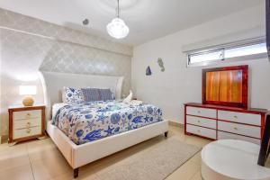 a bedroom with a bed and a dresser and a sink at Las Olas, Juan Dolio 2bed2bath Condo in Guayacanes +19 photos