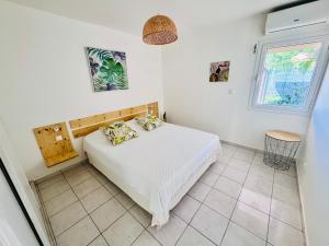 Fotografie z fotogalerie ubytování Appartement paradisiaque les pieds dans l'eau v destinaci Le Gosier