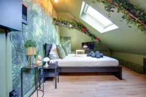 Postel nebo postele na pokoji v ubytování La Suite Jungle - High Tech - NETFLIX - WIFI très Haut Débit