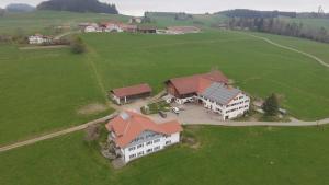 an overhead view of a large house in a field at Ferienhof Krug in Wiggensbach