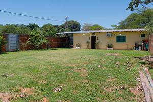 an empty yard in front of a house at Ulises House in Luque