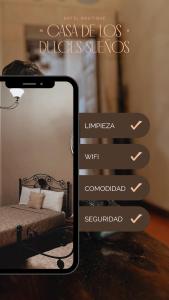 a cell phone taking a picture of a bedroom with a bed at Casa de los Dulces Sueños in Morelia +16 photos