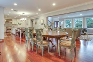 a dining room and kitchen with a table and chairs at Hudson River Views Briarcliff Manor Home with Deck in Briarcliff Manor
