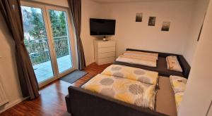 Postel nebo postele na pokoji v ubytování Ferienwohnung Marbachtal Bad Kissingen