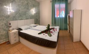 a bedroom with a bed with a teddy bear on it at Vista de Torre in Costa Del Silencio