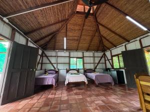 Postel nebo postele na pokoji v ubytování Bamboo Garden Villas + 27 fotografií