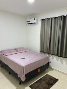 マナウスにあるsmart torquatoの部屋にベッドがある寝室