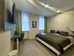 TV a/nebo společenská místnost v ubytování HAVENU Hotel Quartier 8