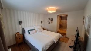 En eller flere senge i et værelse på Apartment Flasch