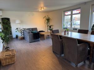 a living room with a table and a couch at 'T centrum Reusel in Reusel
