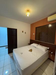 Ένα ή περισσότερα κρεβάτια σε δωμάτιο στο Sitio Rancho da Serra