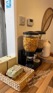 a food processor sitting on top of a microwave at The Bluebird B&B I in Headingley +15 photos