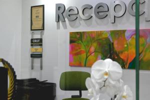 an office with a green chair and a sign at Jordaszka in Wodzisław Śląski