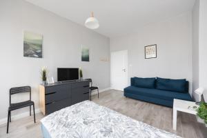 Телевизор и/или развлекательный центр в Pokoje Metro Pole Mokotowskie