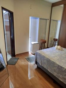 Postel nebo postele na pokoji v ubytování Comfort House Franca SP