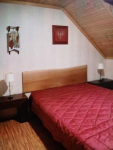 Ένα ή περισσότερα κρεβάτια σε δωμάτιο στο chez Angèle