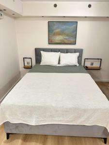 En eller flere senge i et værelse på Studio Galeria