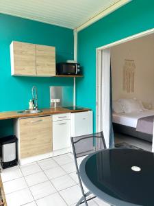 En eller flere senge i et værelse på La Plume Kawannaise - - Accès plage à pieds