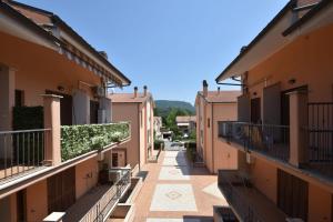 an alley with benches in the middle of buildings at Casa DiVa in Terni