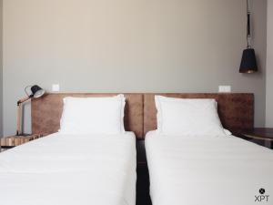 Cama ou camas em um quarto em XPT Águeda - Alojamento Local