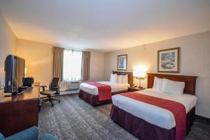 Ένα ή περισσότερα κρεβάτια σε δωμάτιο στο Charles River Inn
