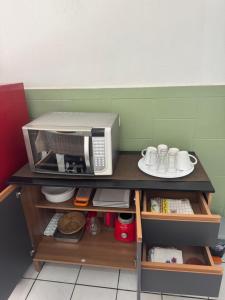 Η κουζίνα ή μικρή κουζίνα στο Loft Zona Sul próximo ao mar