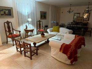 a living room with a couch and a table and chairs at Barrio Privado - YB - Tucumán in Yerba Buena