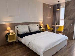 En eller flere senge i et værelse på S Stay Apartments