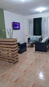 Khu vực ghế ngồi tại Cómodo y acogedor departamento familiar, cerca del casco histórico