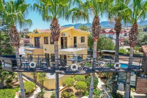 an aerial view of a house with palm trees at Villa Dunya in Kyrenia