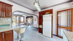 a kitchen with a white refrigerator and a counter at Villa Dunya in Kyrenia