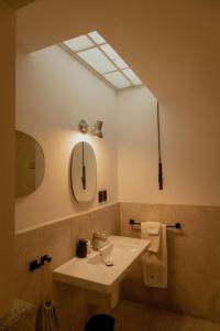 a bathroom with a sink and a mirror at Casa Pani in Mexico City +125 photos