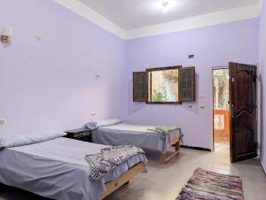 Postel nebo postele na pokoji v ubytování كامب سيوة اواسيس Siwa Oasis Camp