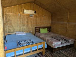 Ένα ή περισσότερα κρεβάτια σε δωμάτιο στο Raha Camp