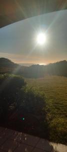 a view of a field with the sun in the sky at Studio face à l océan in Les Sables-dʼOlonne