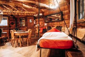 a bedroom with a bed and a table in a cabin at Les Cabanes Du Saleve in Collonges-sous-Salève +246 photos