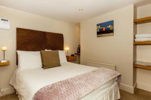 Ένα ή περισσότερα κρεβάτια σε δωμάτιο στο Brightonwave