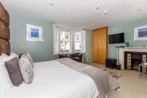 Ένα ή περισσότερα κρεβάτια σε δωμάτιο στο Brightonwave