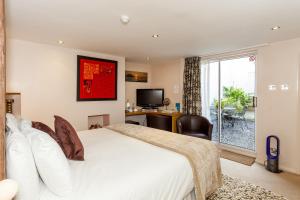 Ένα ή περισσότερα κρεβάτια σε δωμάτιο στο Brightonwave +28 φωτογραφίες