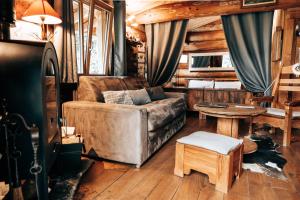 a living room with a couch and a table at Les Cabanes Du Saleve in Collonges-sous-Salève