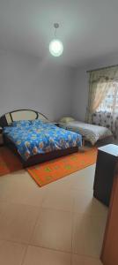 Ένα ή περισσότερα κρεβάτια σε δωμάτιο στο Great 2BR Retreat for Families and Friends!