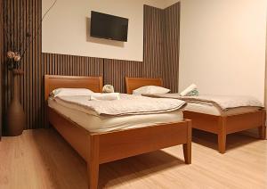 Ένα ή περισσότερα κρεβάτια σε δωμάτιο στο Spa & Pool Apartments Prestige VILLA IVICA