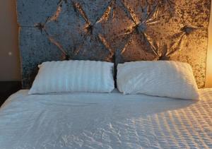 En eller flere senge i et værelse på The Halifax Suites - sleeps 3