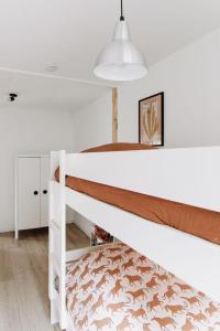 Ένα ή περισσότερα κρεβάτια σε δωμάτιο στο Boshuisje Noi op de Veluwe