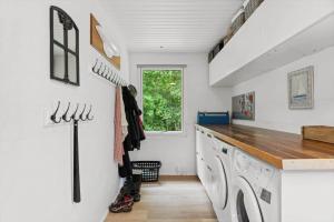 a laundry room with a washer and dryer at LF18116-Veslos-Agerovej-6 in Amtoft